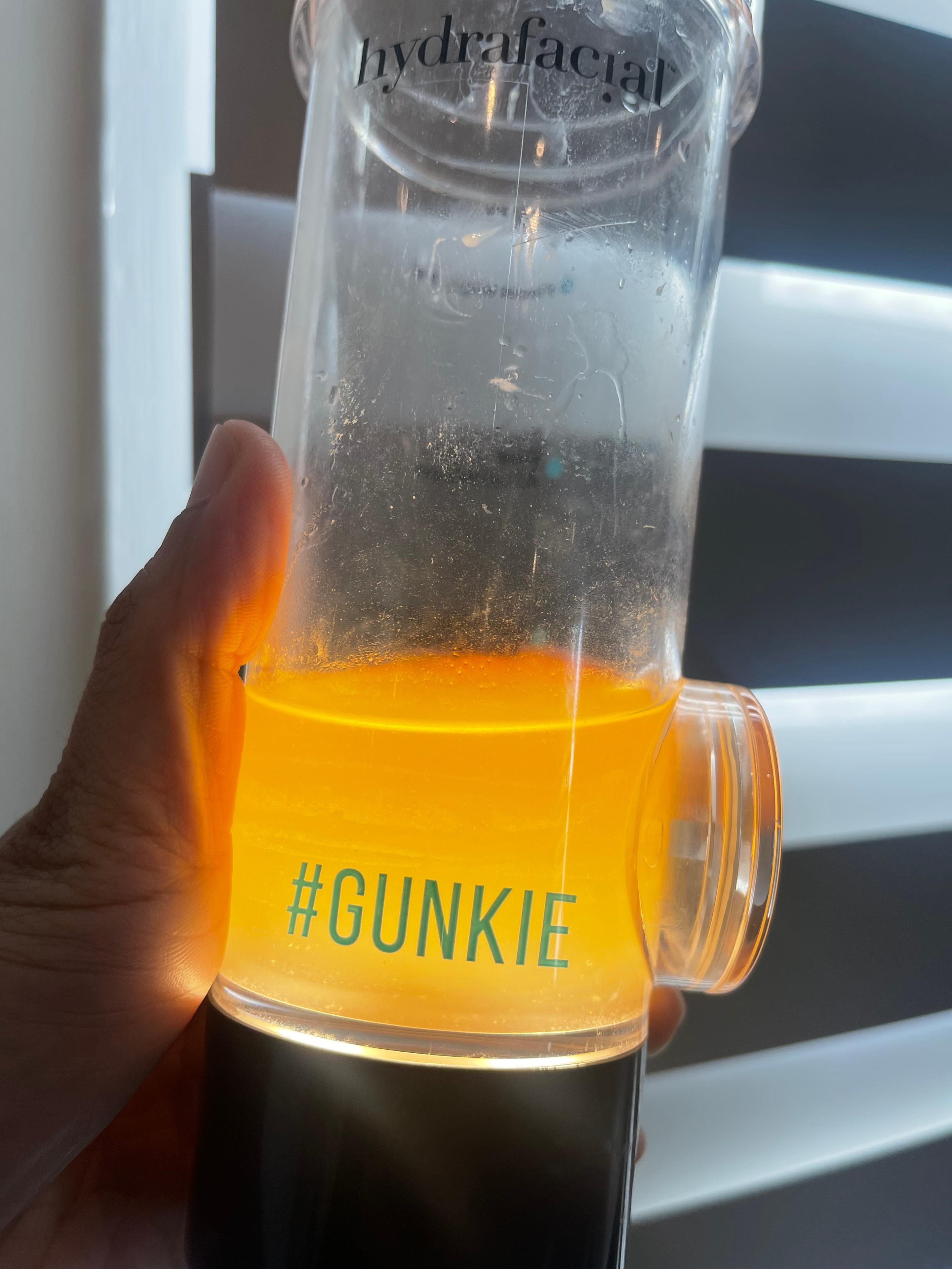 Hydrafacial #Gunkie vial showing extracted impurities after treatment — Bury Skin, Laser & Wellness Clinic, Bury